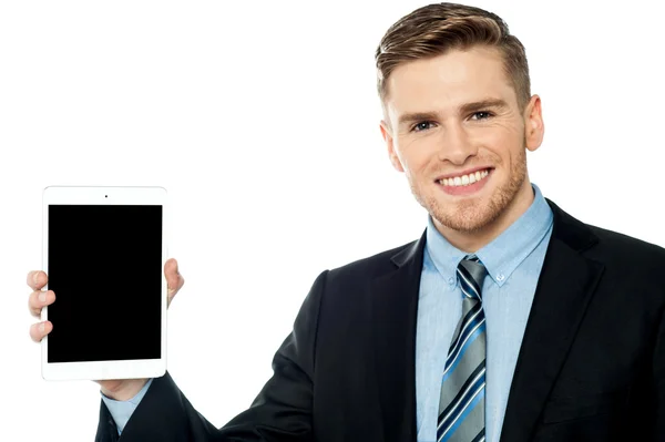 Salesman displaying new tablet device — Stock Photo, Image