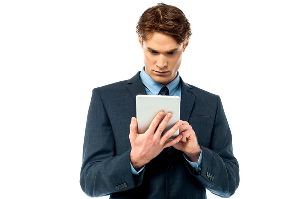 Serious corporate working on tablet pc — Stock Photo, Image