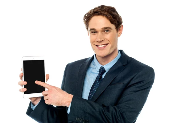 Businessman promoting newly launched tablet — Stock Photo, Image