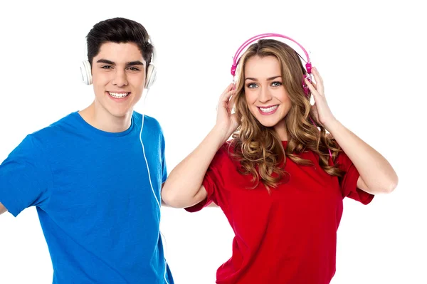 Adorable young couple enjoying music — Stock Photo, Image