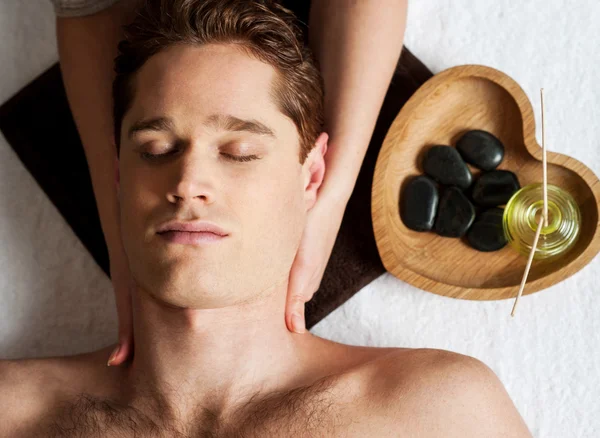 Young man getting face massage — Stock Photo, Image