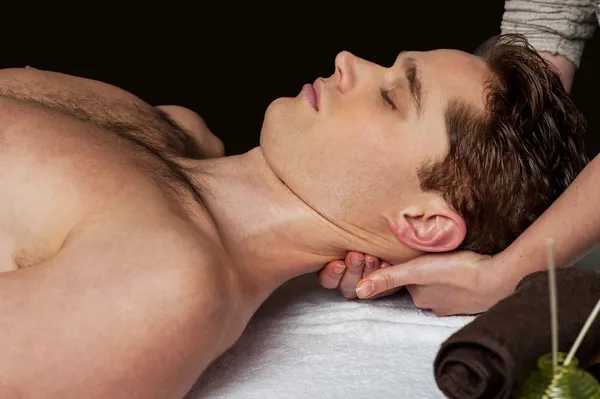 Smart guy getting spa treatment — Stock Photo, Image