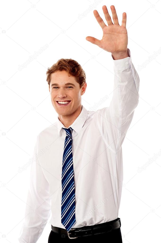 Businessman waving hi to his colleague