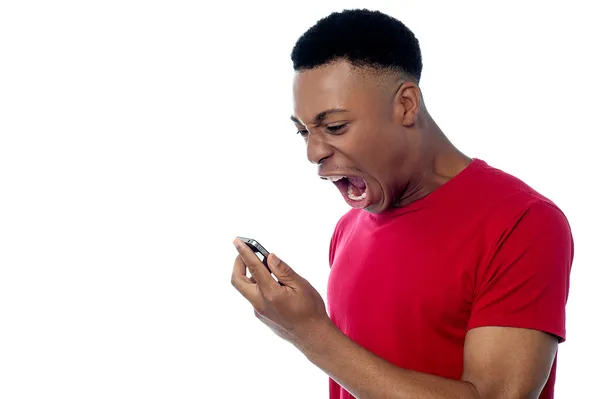 Angry young man yelling — Stock Photo, Image