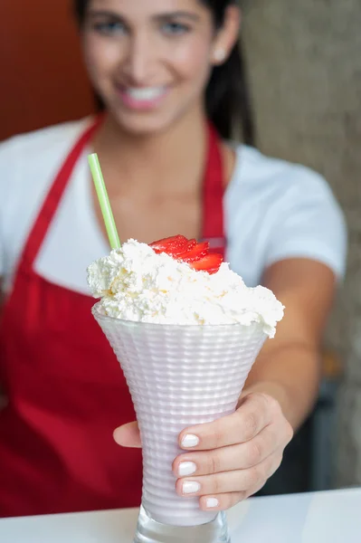 Pretty girl serving strawberry shake — Stock Photo, Image