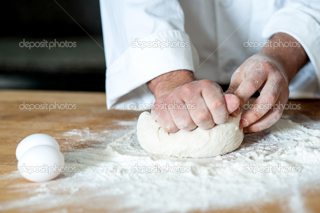Man kneading dough, closeup shot