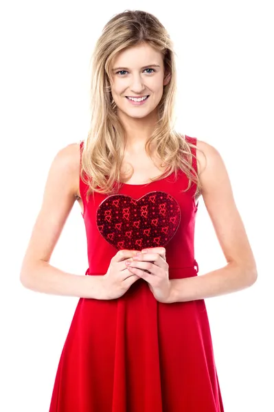 Teen girl holding valentine gift — Stock Photo, Image