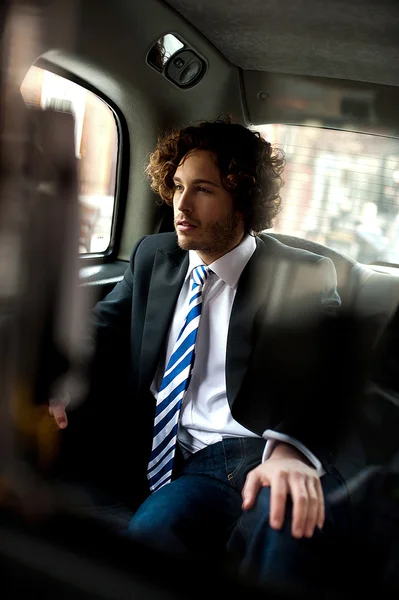 Handsome business executive inside taxi cab — Stock Photo, Image