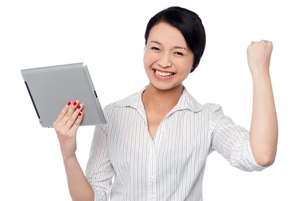 Excited businesswoman holding touch pad — Stock Photo, Image