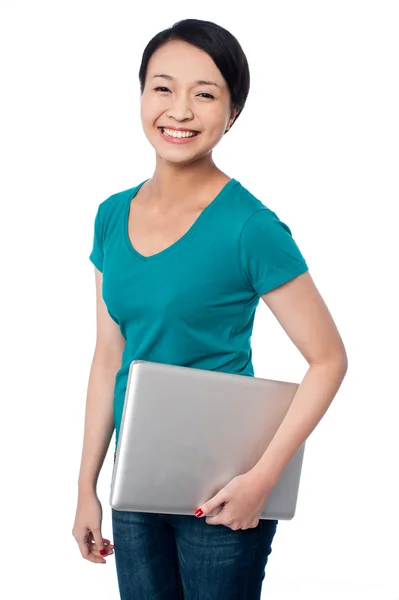 Smiling asian female posing with laptop — Stock Photo, Image