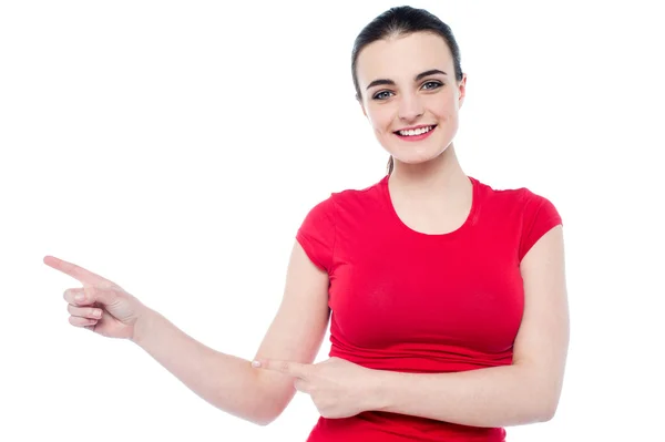 Woman pointing to her right — Stock Photo, Image