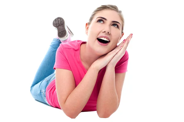 Smiling girl lying on floor — Stock Photo, Image