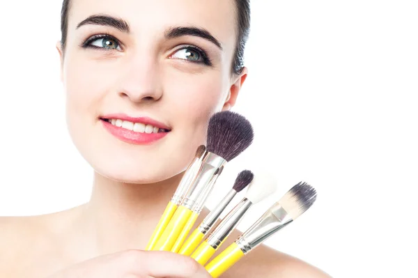 Glamorous girl with makeup brushes — Stock Photo, Image