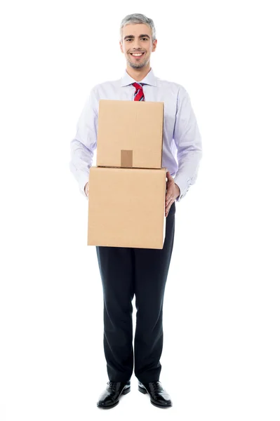 Handsome male with with stack of boxes — Stock Photo, Image