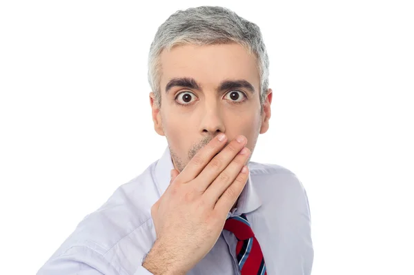 Senior mature man closing mouth with hand — Stock Photo, Image