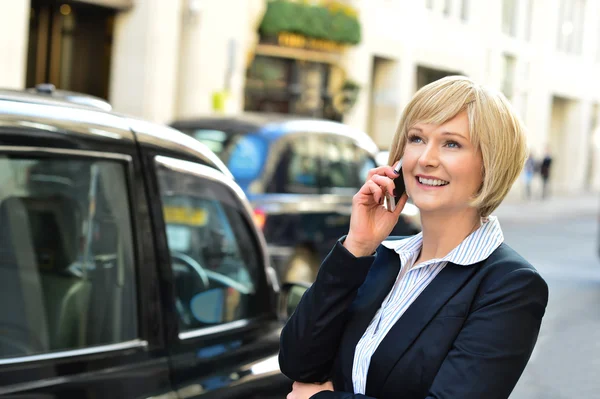 Woman attending a business call — Stock Photo, Image