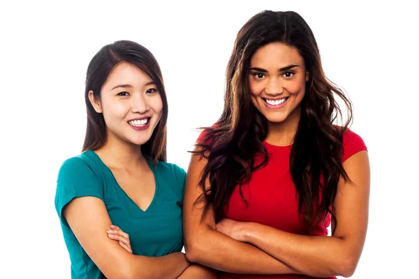 Pretty girls posing with arms crossed — Stock Photo, Image