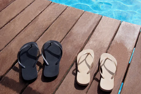 Flip flops by the swimming pool — Stock Photo, Image