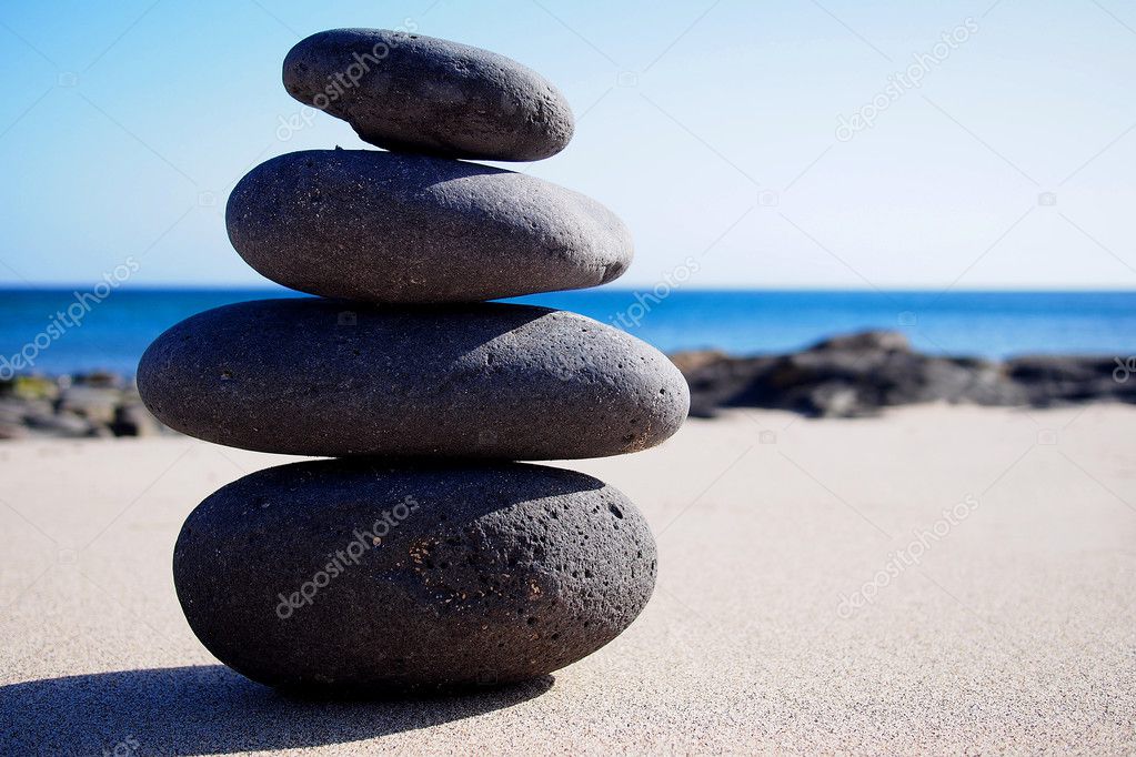 Stack of zen stones on the sand