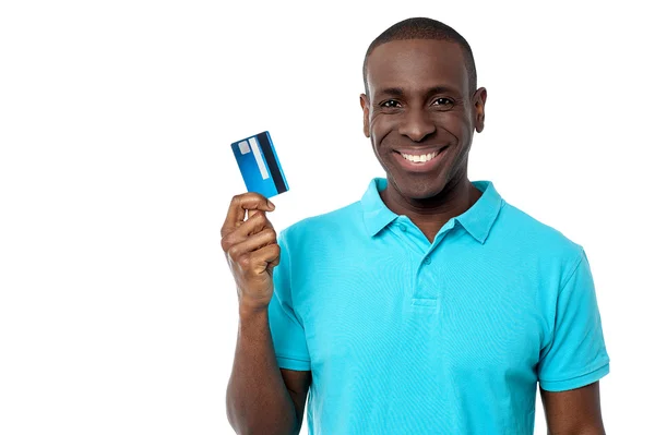 Smiling guy holding credit card — Stock Photo, Image