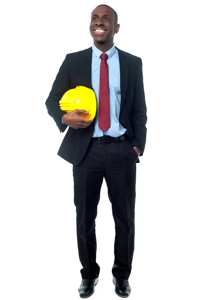 Empresário posando com capacete de construção — Fotografia de Stock