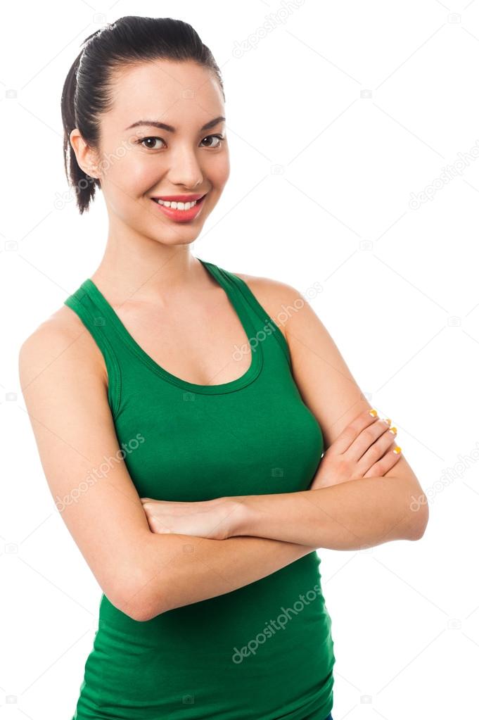 Attractive girl posing, crossed arms Stock Photo by ©stockyimages 44187291