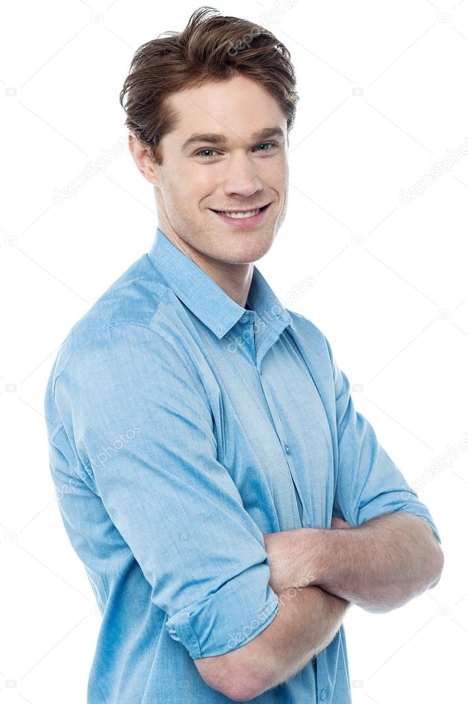 Casual smiling man with arms crossed