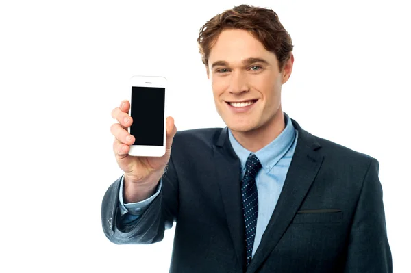 Salesman displaying newly launched mobile — Stock Photo, Image