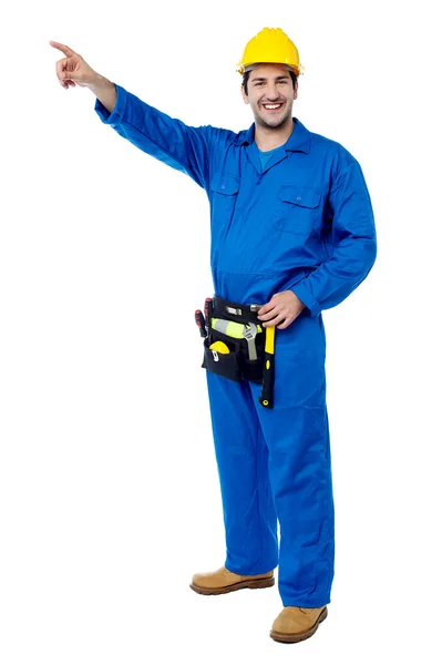 Happy male worker pointing at something — Stock Photo, Image