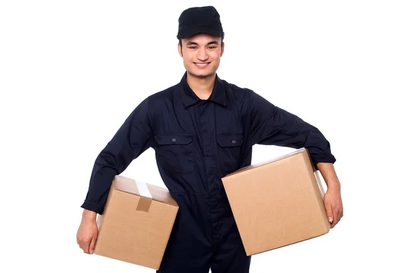 Young courier guy holding boxes — Stock Photo, Image