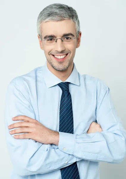 Cheerful corporate man with arms folded — Stock Photo, Image