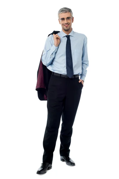 Happy young bussiness man with coat on shoulder — Stock Photo, Image
