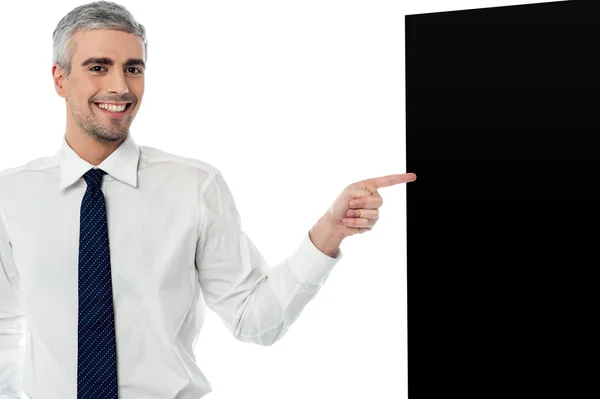 Businessman with black panel — Stock Photo, Image