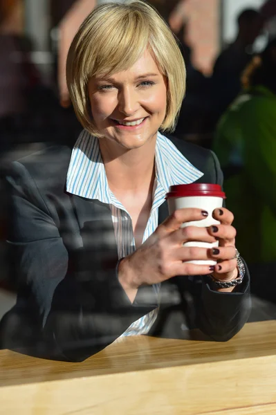 Business lady enjoying her refreshment — Stock Photo, Image