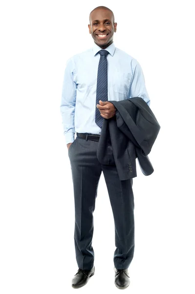 Relaxed businessman holding coat — Stock Photo, Image