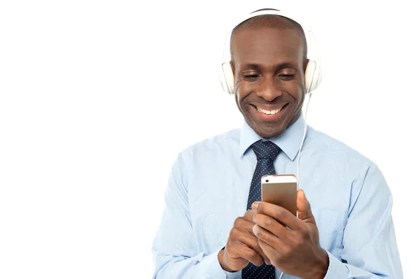 Businessman enjoying music — Stock Photo, Image