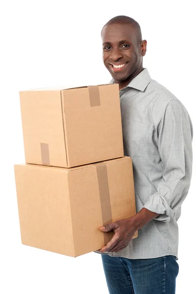 Man handing pile of boxes — Stock Photo, Image