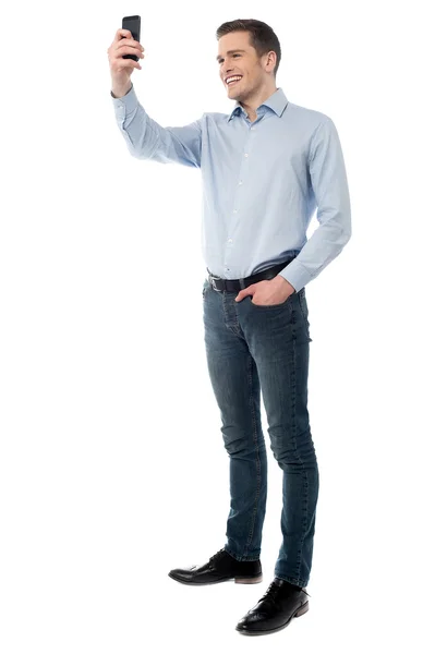 Smiling casual man taking a picture of you — Stock Photo, Image