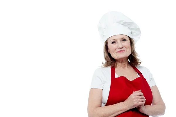 Portrait of a smiling female chef, hands clasped — Stock Photo, Image