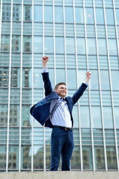 Excited businessman raising arms — Stock Photo, Image