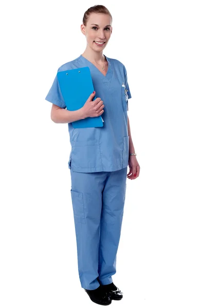 Female nurse holding clipboard — Stock Photo, Image