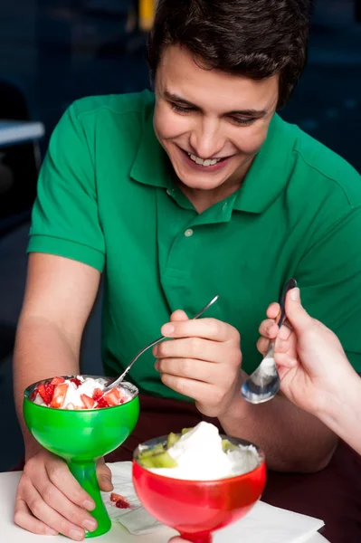 Young guy enjoying tempting dessert — Stock Photo, Image