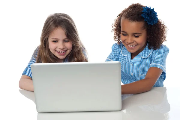 School girls using laptop together — Stock Photo, Image