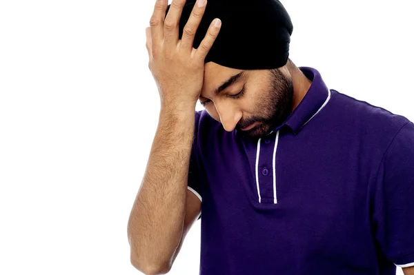 Upset man holding his forehead — Stock Photo, Image