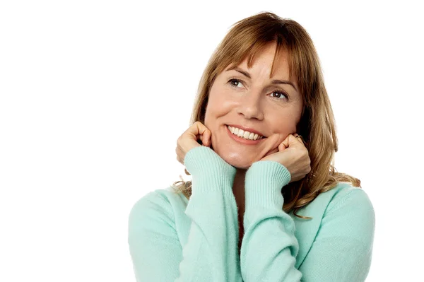 Happy female with hands on chin — Stock Photo, Image