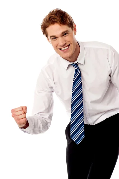 Enthusiastic corporate man clenching fist — Stock Photo, Image