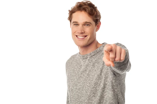 Smiling young man pointing you out — Stock Photo, Image