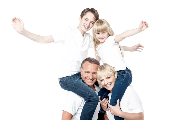 Familia alegre sobre fondo blanco — Foto de Stock