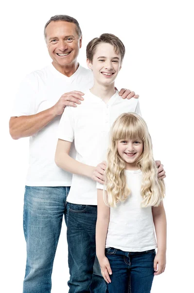 Happy father with children standing in row — Stock Photo, Image