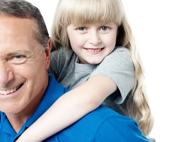 Father carrying daughter on back — Stock Photo, Image